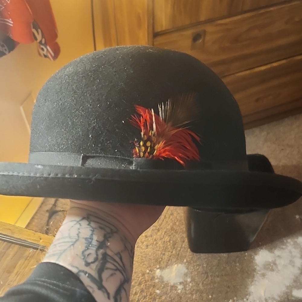 Black Bowler Hat with Red Feather Accent